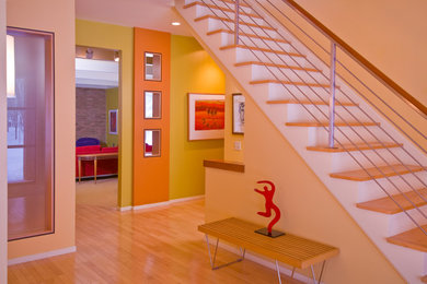 Example of an eclectic staircase design in Detroit