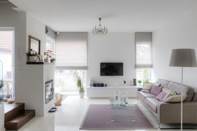 Living room - small eclectic living room idea in Detroit with white walls, a two-sided fireplace and a wall-mounted tv