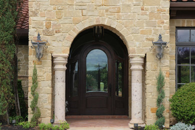 Large tuscan entryway photo in Austin
