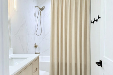 Example of a small minimalist kids' white tile and porcelain tile porcelain tile, white floor and single-sink bathroom design in Baltimore with flat-panel cabinets, beige cabinets, a one-piece toilet, white walls, an undermount sink, quartz countertops, white countertops and a freestanding vanity