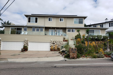 Example of a huge mid-century modern exterior home design in Orange County