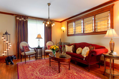 Mid-sized elegant medium tone wood floor living room photo in Chicago with beige walls