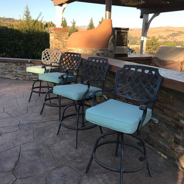 Calming blue cushions blend with serene mountain pool deck