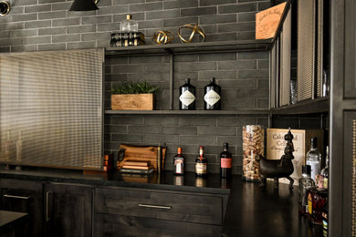 Inspiration for a mid-sized industrial home bar remodel in Houston