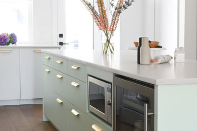 Inspiration for a large contemporary l-shaped eat-in kitchen remodel in Vancouver with quartz countertops, gray backsplash, quartz backsplash, an island and gray countertops