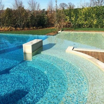 Modern pool with custom gradient mosaic tile