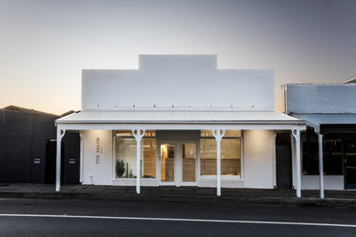 Design ideas for a mediterranean house exterior in Wollongong.