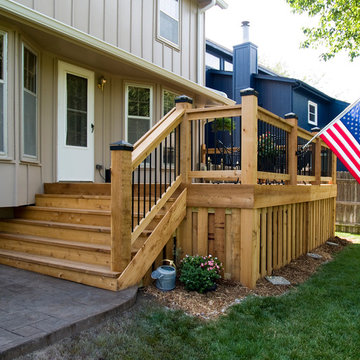 Stoerman - Cedar deck in Overland Park, Ks.  Stamped concrete patio & deck light