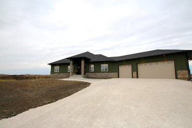 Mid-sized contemporary green one-story mixed siding exterior home idea in Other