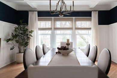 Inspiration for a mid-sized transitional coffered ceiling and wall paneling great room remodel in New York with blue walls