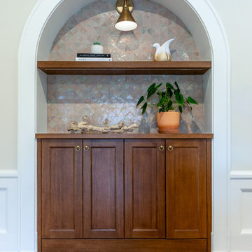 Arch Motif Repeated in Family Room Bookcases