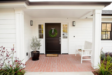 Large country white one-story wood house exterior photo in San Diego with a hip roof and a shingle roof