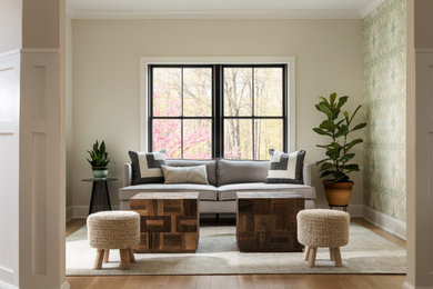Example of a transitional light wood floor and wallpaper living room design in New York with white walls
