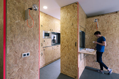 Eat-in kitchen - mid-sized industrial galley eat-in kitchen idea in Madrid with no island