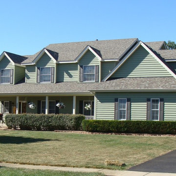 Country Design with Front Porch, side Loading Garage and Two Interior Staircases