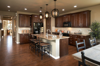 Example of a transitional kitchen design in Denver