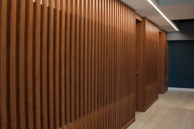 Large trendy walk-out ceramic tile basement photo in DC Metro with gray walls