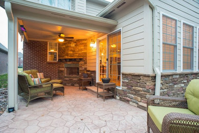 Example of a mid-sized classic home design design in Indianapolis