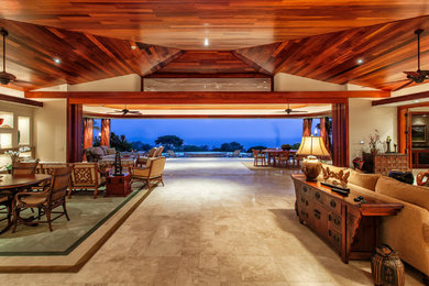 Inspiration for a huge tropical open concept family room remodel in Hawaii with white walls