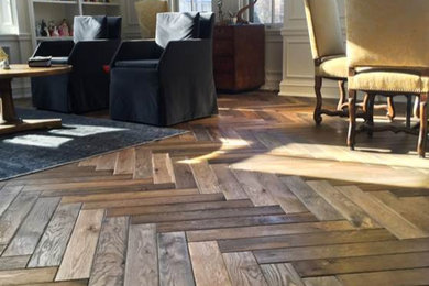 Minimalist multicolored floor and medium tone wood floor living room photo in Other