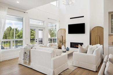 Mid-sized beach style living room photo in Vancouver with white walls