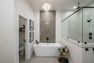 Example of a mid-sized minimalist master white tile and porcelain tile porcelain tile, gray floor and double-sink bathroom design in Little Rock with flat-panel cabinets, gray cabinets, white walls, an undermount sink, marble countertops, a hinged shower door, white countertops and a built-in vanity