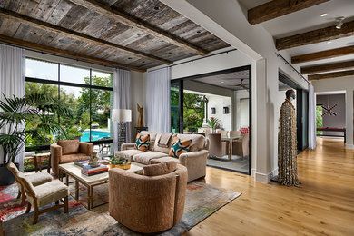 Example of a transitional formal and open concept light wood floor and wood ceiling living room design in Denver