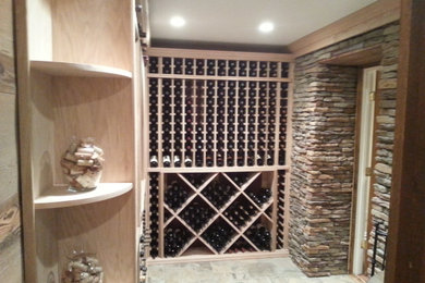 Inspiration for a timeless wine cellar remodel in New York