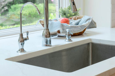 Example of a mid-century modern laundry room design in Atlanta