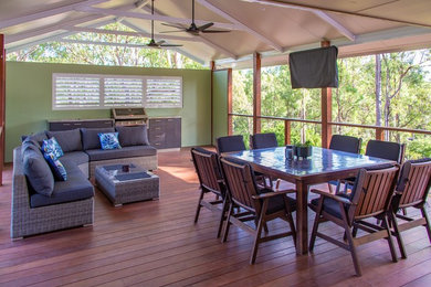 This is an example of a beach style deck in Brisbane.