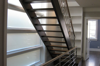 Design ideas for a large modern wood straight staircase in Chicago with open risers.