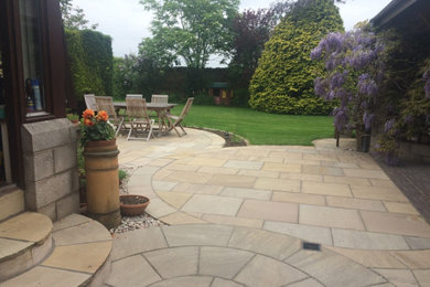 This is an example of a garden in Essex with natural stone pavers.