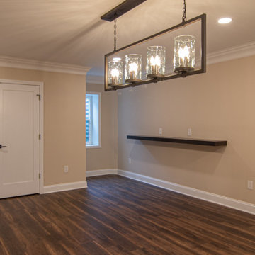 Basement Showing Warm Colors, Straight Lined Cabinets and Stacked Stone