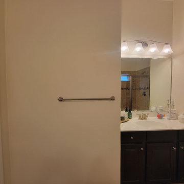 Before: Bathroom Vanity with Full-Height Mirror and Overhead Lighting