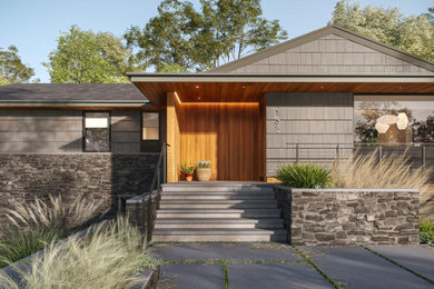 Mid-century modern exterior home idea in Other