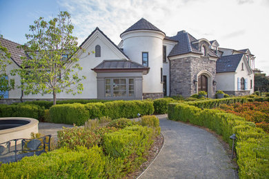 Example of a french country exterior home design in San Diego