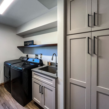 Laundry Room with Custom Cabinetry Quartz Countertop and Custom Floating Shelf