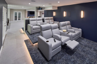 Home theater - large contemporary open concept carpeted and blue floor home theater idea in Charlotte with blue walls and a projector screen