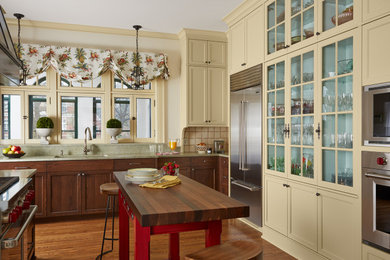 Design ideas for a traditional eat-in kitchen in Minneapolis with an undermount sink, white cabinets, granite benchtops, white splashback, terra-cotta splashback, stainless steel appliances, medium hardwood floors, with island, brown floor, green benchtop and shaker cabinets.