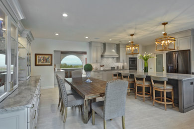 Inspiration for a transitional l-shaped kitchen remodel in Phoenix with an island