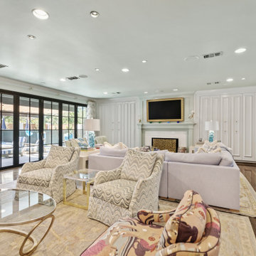 Spacious and Elegant Living Room with Floor-to-Ceiling Windows and Vibrant Patte