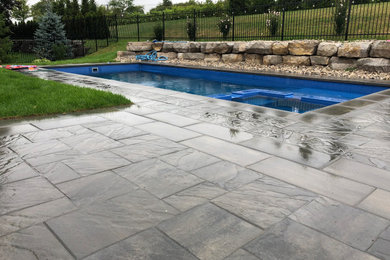 Inspiration for a rustic pool remodel in Toronto