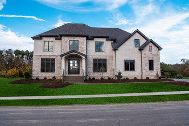 Inspiration for a large transitional white two-story house exterior remodel in Other with a shingle roof