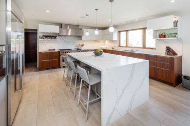 Example of a large minimalist u-shaped porcelain tile and beige floor eat-in kitchen design in San Francisco with an undermount sink, flat-panel cabinets, dark wood cabinets, solid surface countertops, white backsplash, quartz backsplash, stainless steel appliances, an island and white countertops