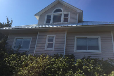 Example of a beach style exterior home design in Other