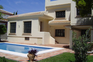 Example of a trendy home design design in Malaga