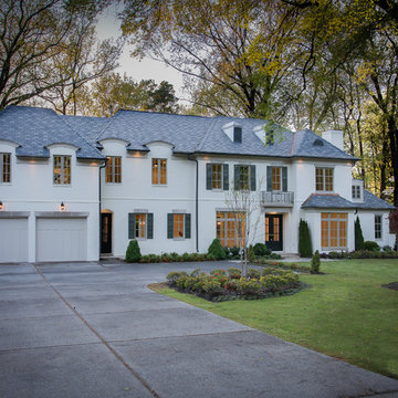 Exterior view -- slate roof, mature oak trees