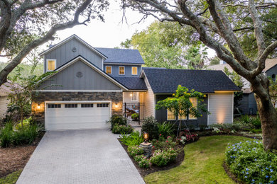 Example of a mid-sized mountain style gray two-story concrete fiberboard exterior home design in Jacksonville with a shingle roof