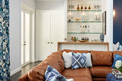 Family room - transitional open concept porcelain tile family room idea in Miami with a bar, a wall-mounted tv and gray walls