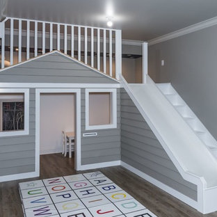 Inspiration for a modern gender neutral children’s room in New York with grey walls, laminate floors and grey floors.